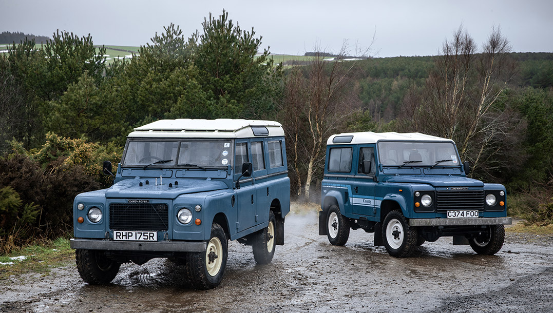 Blue Land Rover Defender 90 and Blue Land Rover Defender 110 parked next to eachother